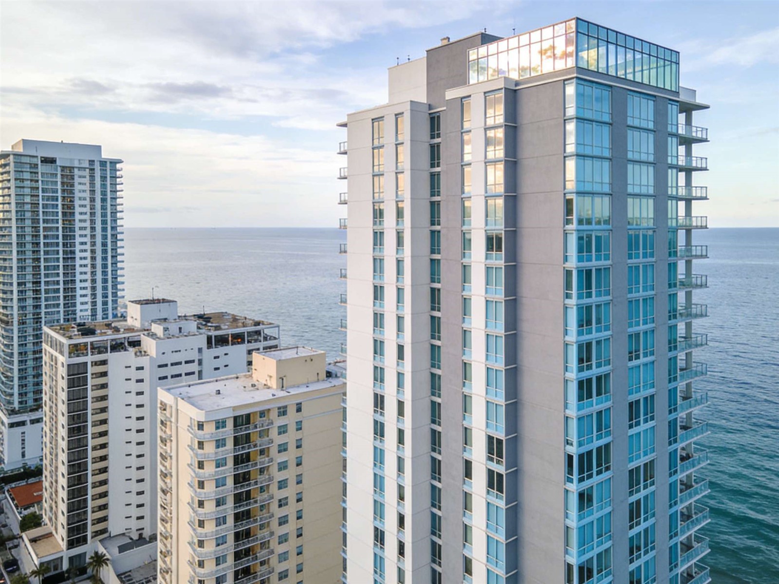 Laminated glass impact windows installed on a high-rise coastal building during construction Laminated glass impact windows installed on a high-rise coastal building during construction